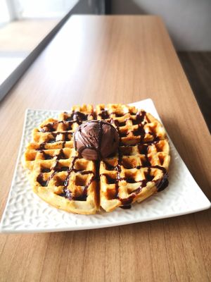 Very yummy waffles with a good level of crisp topped with dark choc ice-cream and drizzled with choc sauce at Loving Nature Fortunate Coffee Cafe in Central Singapore