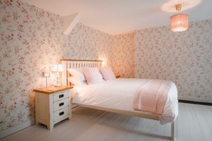 King sized bed in the pet friendly room at The Green Door Vegan B&B - Pet-friendly Room in Llanon