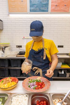 Cooking Jamila Salad and Heura Poké Bowl at Bibra Real Food in Malaga