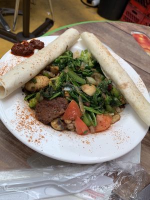 Vegan lunch special with vegan meat and awaze sauce on the side at Heat Da Spot Café in Washington