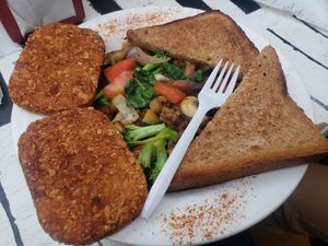 Vegan Breakfast Plate: Sauteed veggies with Beyond Burger, hash browns, and toast. at Heat Da Spot Café in Washington