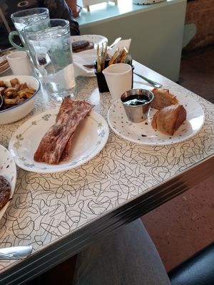 Crunchy Bacon and a biscuit 😋 at Spiral Diner & Bakery in Fort Worth