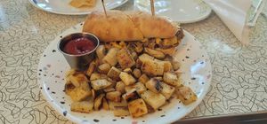 The Philly Mac with home fries at Spiral Diner & Bakery in Fort Worth