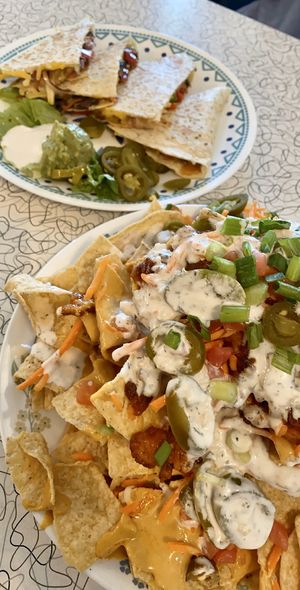 Spicy Buffalo Chik’n Nachos and Grilled Portobello Quesadilla  at Spiral Diner & Bakery in Fort Worth