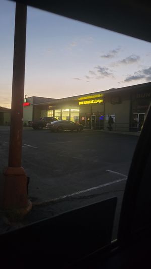 Parking lot and storefront at Himalayan Grill in Flagstaff