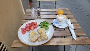 Vegan breakfast - capuchino, OJ, and hummus toast at Ben Caffè in Florence