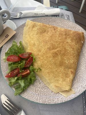 Savoury crepe filled with mushrooms, cheese and more  at Chocolat Cafe Creperie in Naxos