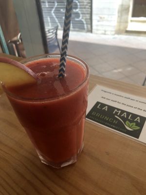 Grapefruit, apple, raspberry, mango smoothie  at La Mala Brunch in Sevilla