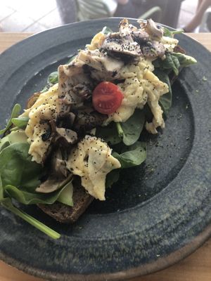 Egg, spinach, tomato and avocado toast  at La Mala Brunch in Sevilla