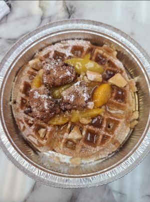 Chikn and Waffles topped with Peaches 🍑 at Nanas Kitchen in Chandler