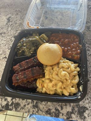 7/10 ribs tasted like meat loaf to me, added a salt packet to the collared greens, corn bread was a little dry, the beans were very flavorful and the mac & cheese was delicious  at Nanas Kitchen in Chandler