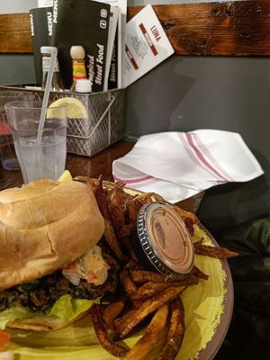 Burger with fries at Luna Inspired Street Food in Ithaca