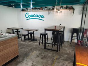 Indoor dining area at Coocaca - Liat Towers in Central Singapore