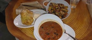 Chili, side of potatoes and biscuit at Rooted: Eat More Plants in Medford