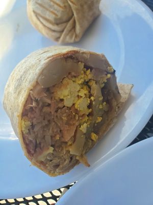 Salsa verde breakfast burrito with jackfruit at Rooted: Eat More Plants in Medford