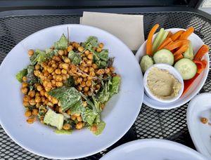 Ceaser salad and hummus  at Rooted: Eat More Plants in Medford