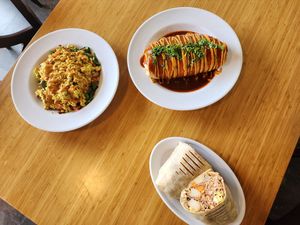 I missed taking a photo of my Chickpea patty melt. This is the table next to me burritos and tofu scramble. Everything looks delicious! at Rooted: Eat More Plants in Medford