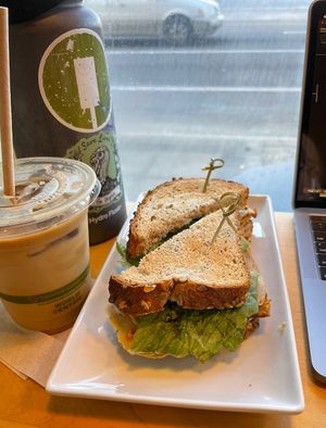 Iced Dirty Chai Latte w/ Oat Milk & Club Sandwich  at Karma Cream in Gainesville
