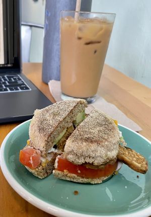Iced Americano w/ Oat milk & Breakfast Sandwich on an English muffin.  at Karma Cream in Gainesville