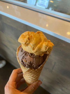 Vegan ice cream waffle cone with scoop of pumpkin pie and chocolate walnut flavor at Karma Cream in Gainesville