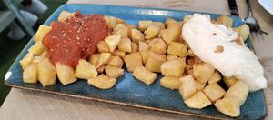 Patatas braviolis at Sidrería As de Guía in Llanes