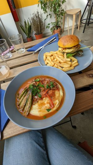 Plate of the day (polenta) and a veggie burger at Tataoim in Lisbon