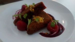 Earl grey cake with beetroot jam, fresh raspberries and passionfruit at 1847 in Manchester
