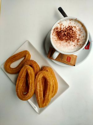 Soy cappuccino and churros at Es Fornet in Cadaques
