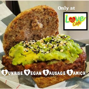 Ezekiel English Muffin,  vegan sausage,  mashed avocado, everything bagel seasoning at Love Café in South Hill