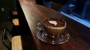 Hot chocolate and seating at bar stool area at Coffee Doga Heritage - Ehwa branch 커피도가 헤리티지 이화점 in Seoul