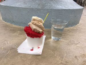Malaga, coconut and raspberry flavored gelato, and a kindly poured glass of fresh mountain sourced water from the wonderful staff at Cattarissimo in Kotor