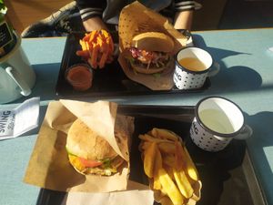 Vienna Burger with fries and Cheese Burger owith sweet potato fries. at Swing Kitchen - Universitätsring in Vienna