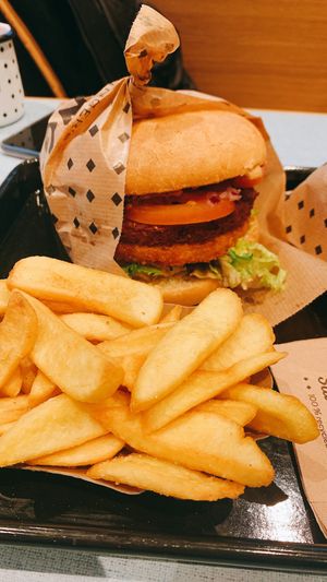 burger with rösti and fries  at Swing Kitchen - Universitätsring in Vienna