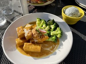Peanut tofu and broccoli, comes with their  blue rice   at September in Bangkok in New Haven