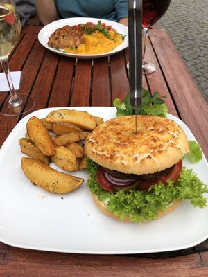 Vegan veggieburger and marinated tofu, with smashed carrot-potatoes and cherry tomato ragout. at Ratsstube in Ruedesheim Am Rhein