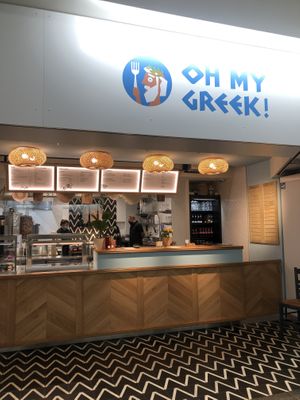 tables without chairs are provided for. at Oh My Greek in Winterthur