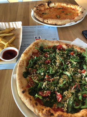 vegan pizza with shredded tofu, and chips at Forum Przestrzenie in Krakow