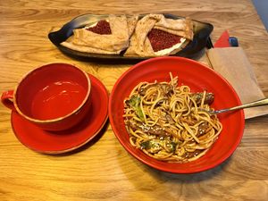 Pancakes and udon noodles with soy “meat”  at Good Food Bowl in Moscow