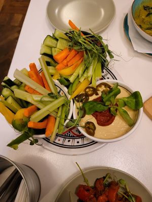 One hummus dish came with 2 bowls of fresh vegetables at Hamsa in Krakow