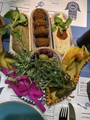 small mezze set with baba ghanoush, falafel and maghreb hummus  at Hamsa in Krakow