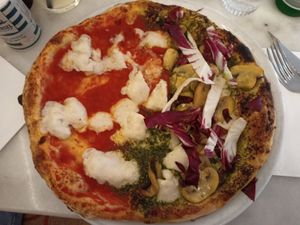 Half vegan margherita half vegan bianca at Chicago Trattoria in Brussels