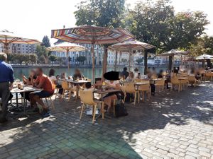 Riverside seating at Zunfthaus zu Pfistern in Luzern