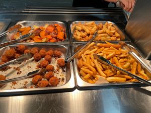 Arancini, fries, spring rolls and roasted veggies. Nann and garlic bread to the left.  at Vegie Tribe in Melbourne