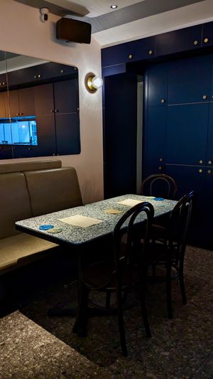 Indoor seating with tables locally made using recycled plastic at Analogue Initiative in Central Singapore