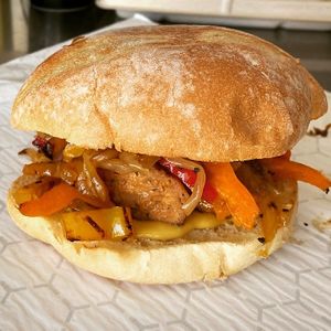 Sausage on Bun 
A genuine taste of New York!
Beyond Meat™ Hot Italian Sausage topped with Organic Sautéed Red Peppers, 
House-Made Organic Sauerkraut and Organic Mustard at The Hearty Herbivore in Komoka