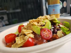 TACO BOWL  
Organic Green Leaf Lettuce topped with House-Made Beyond™ Taco Meat, Cheese, 
Organic Black Beans, Organic Tomato, Avocado, Salsa & Crumbled Organic Tortilla Chips at The Hearty Herbivore in Komoka