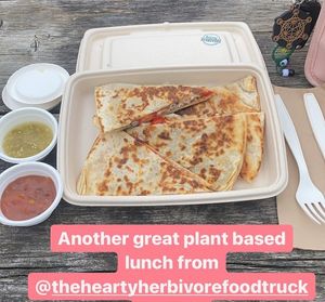 Organic Quesadilla
Stuffed with Re-fried Beans, Black Beans, Tomatoes, Red Peppers and Cheese. 
Served with Salsa Verde or Black Bean Salsa at The Hearty Herbivore in Komoka