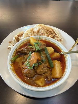 Chicken curry with roti  at Mudita in Auckland