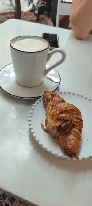 Chocolate cream croissant and macchiato with oat milk at Eutopia in Milan
