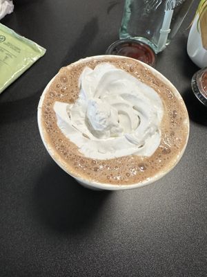 Hot chocolate with whipped cream  at Rooted and Rind in Delmar